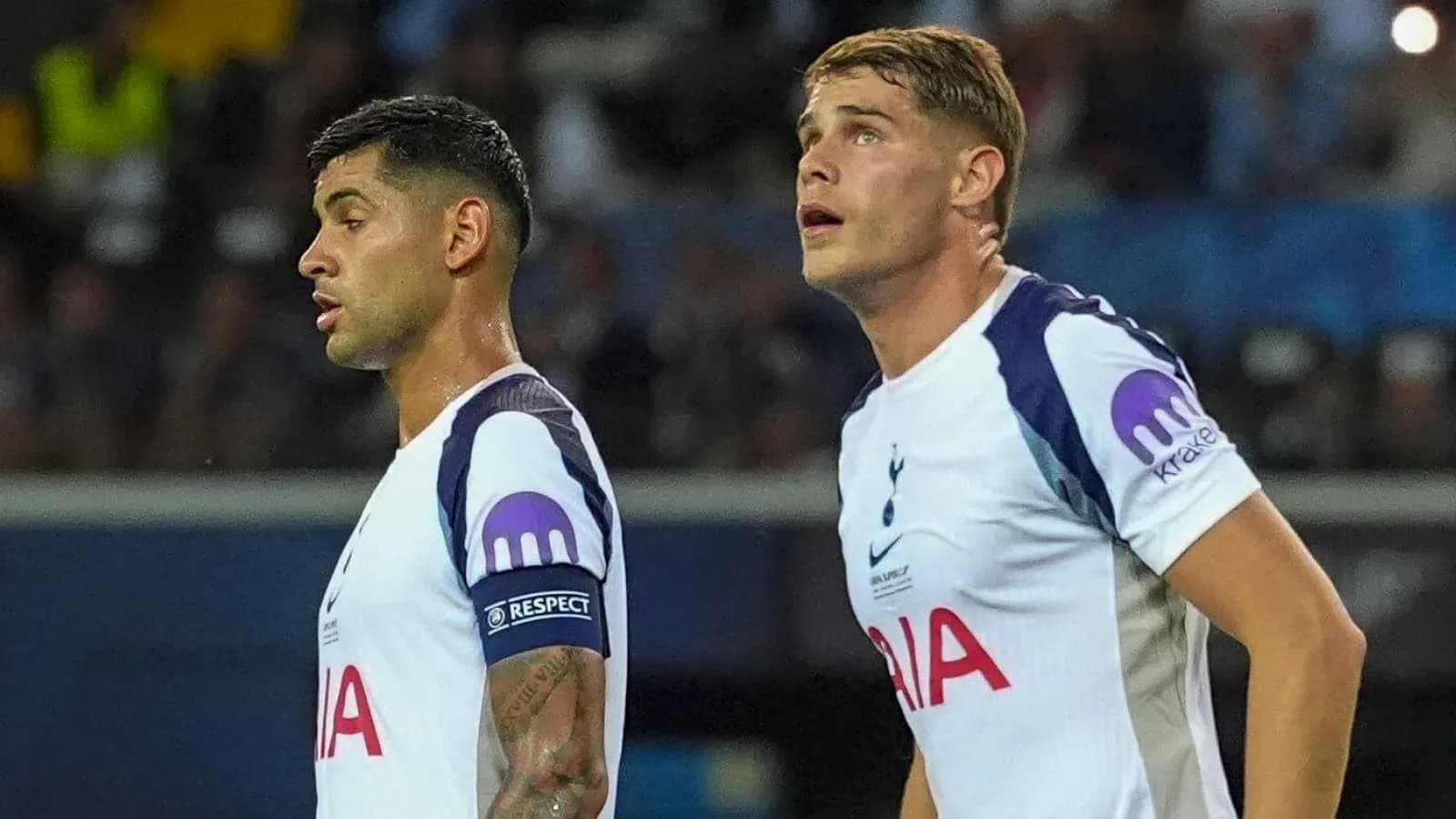 Two Tottenham players observing the match action