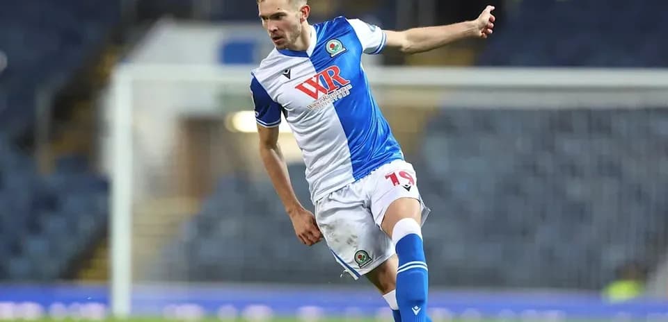 Player kicking the ball on the field