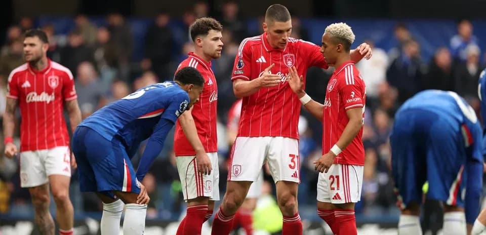 Players discussing strategy during a football match