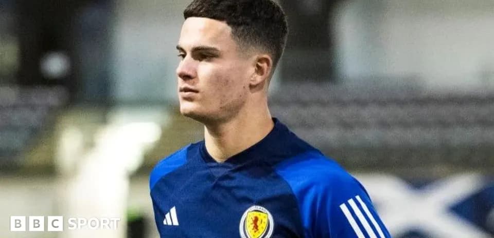 Player walking on training pitch in Scotland kit