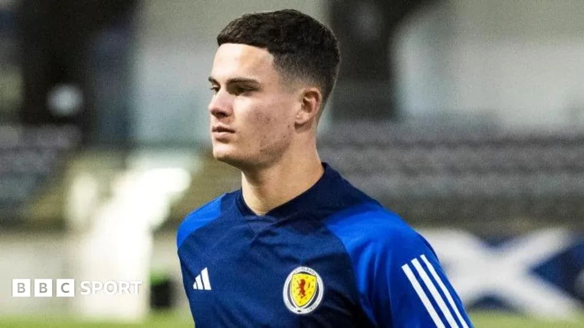 Player walking on training pitch in Scotland kit