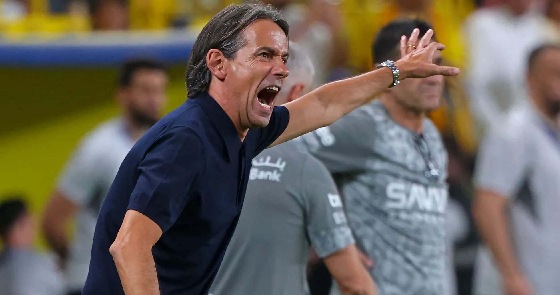 Coach shouting instructions from the sidelines during match