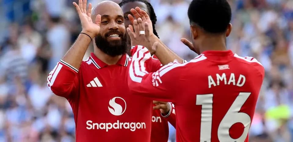 Manchester United players celebrating during match