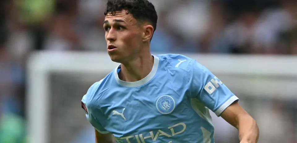 Phil Foden running during Manchester City match