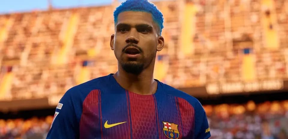 Player in Barcelona jersey with blue hair