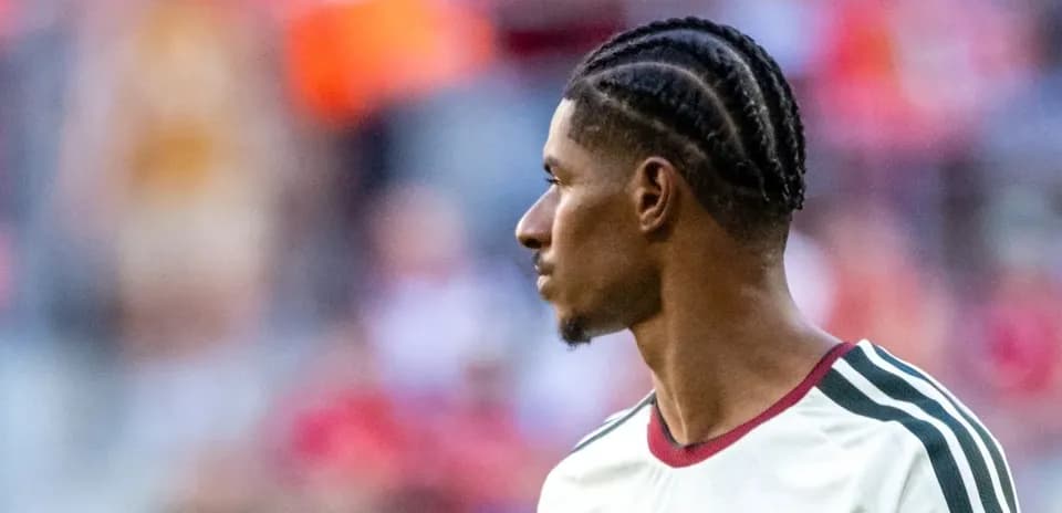 Player with braided hair during warm-up session