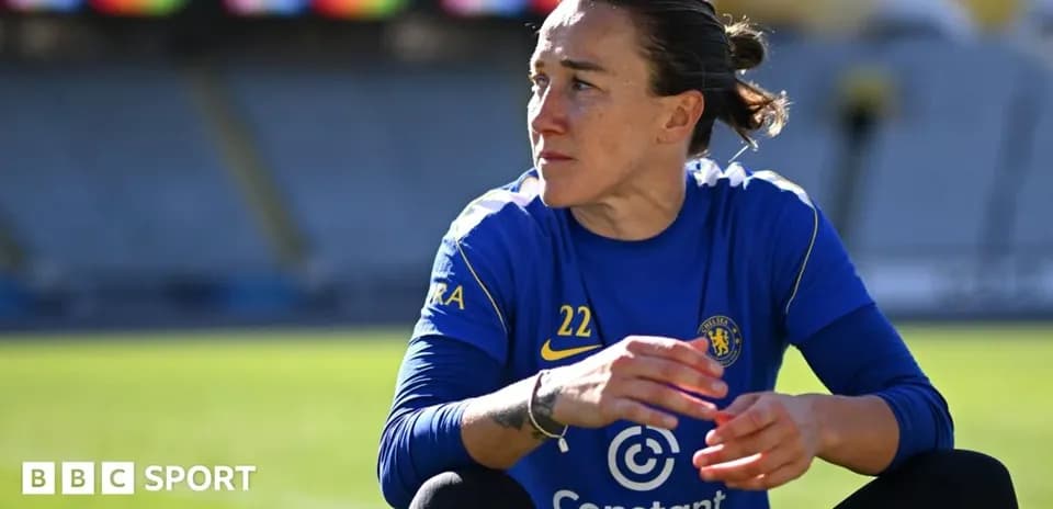 Player in blue kit sitting on pitch during training