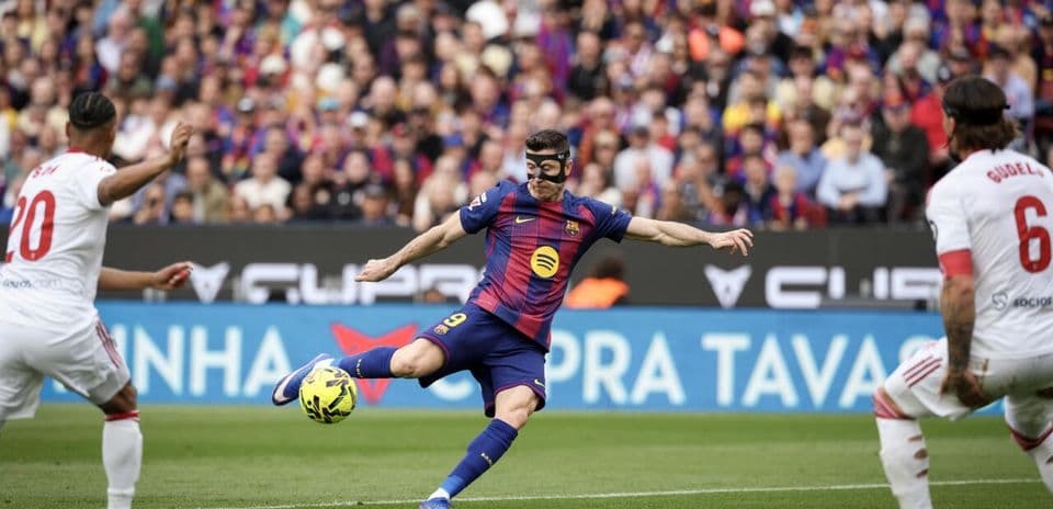 Player in mask striking the ball during match