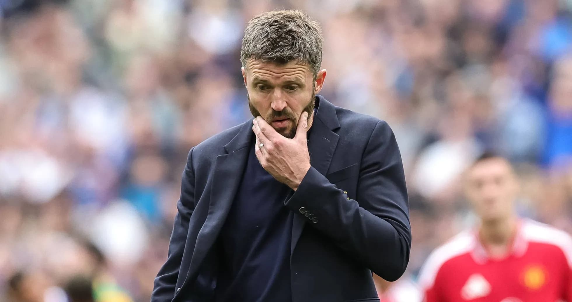 Manager contemplating during a football match