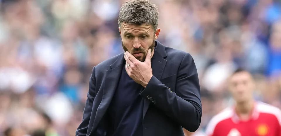 Manager contemplating during a football match
