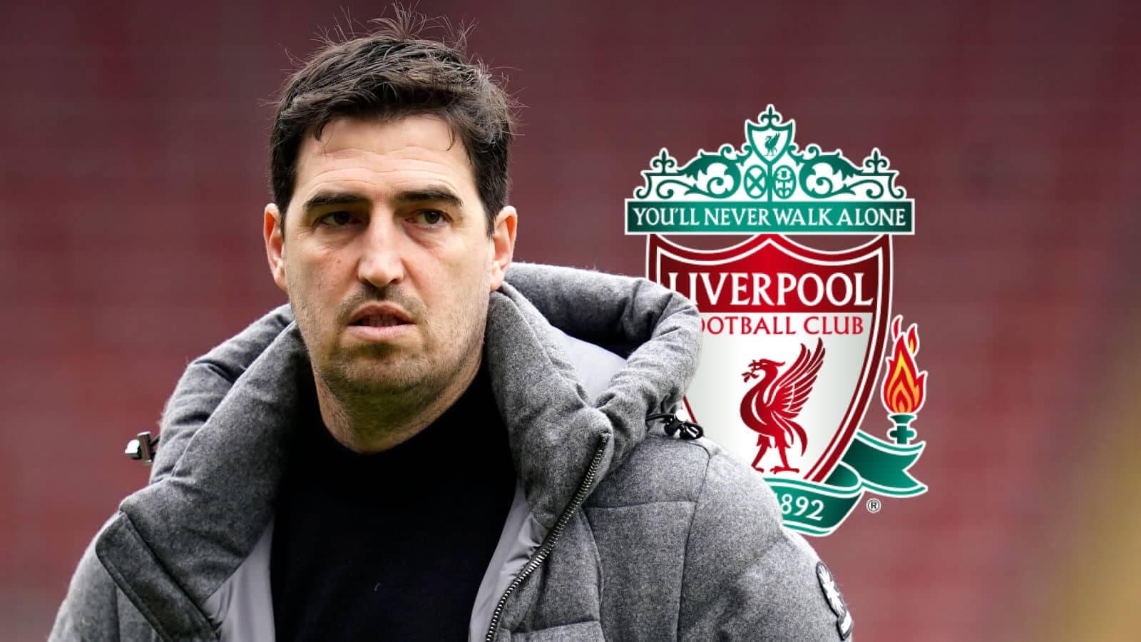 Coach standing in front of Liverpool FC logo