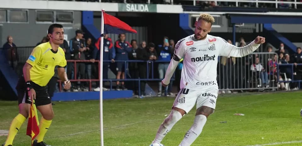 Player taking a corner kick near the flag