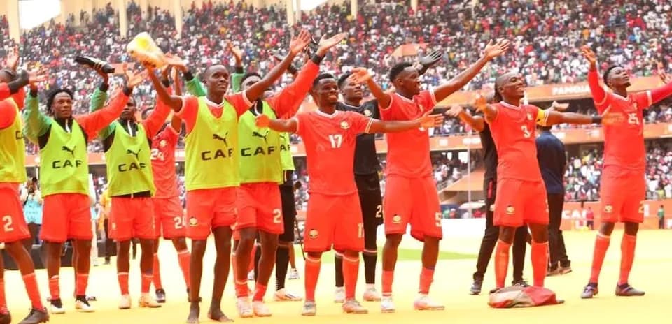 Players celebrating with fans after the match