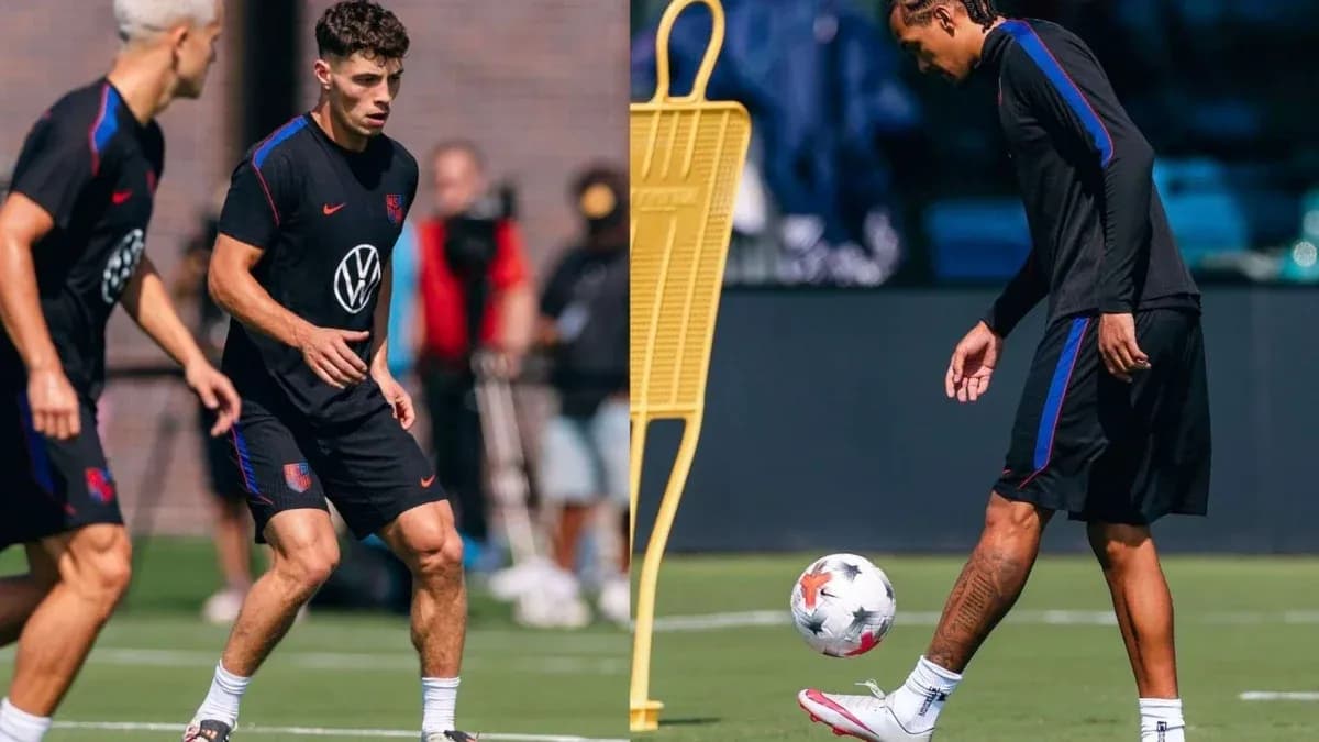 Two players training on the field with a soccer ball