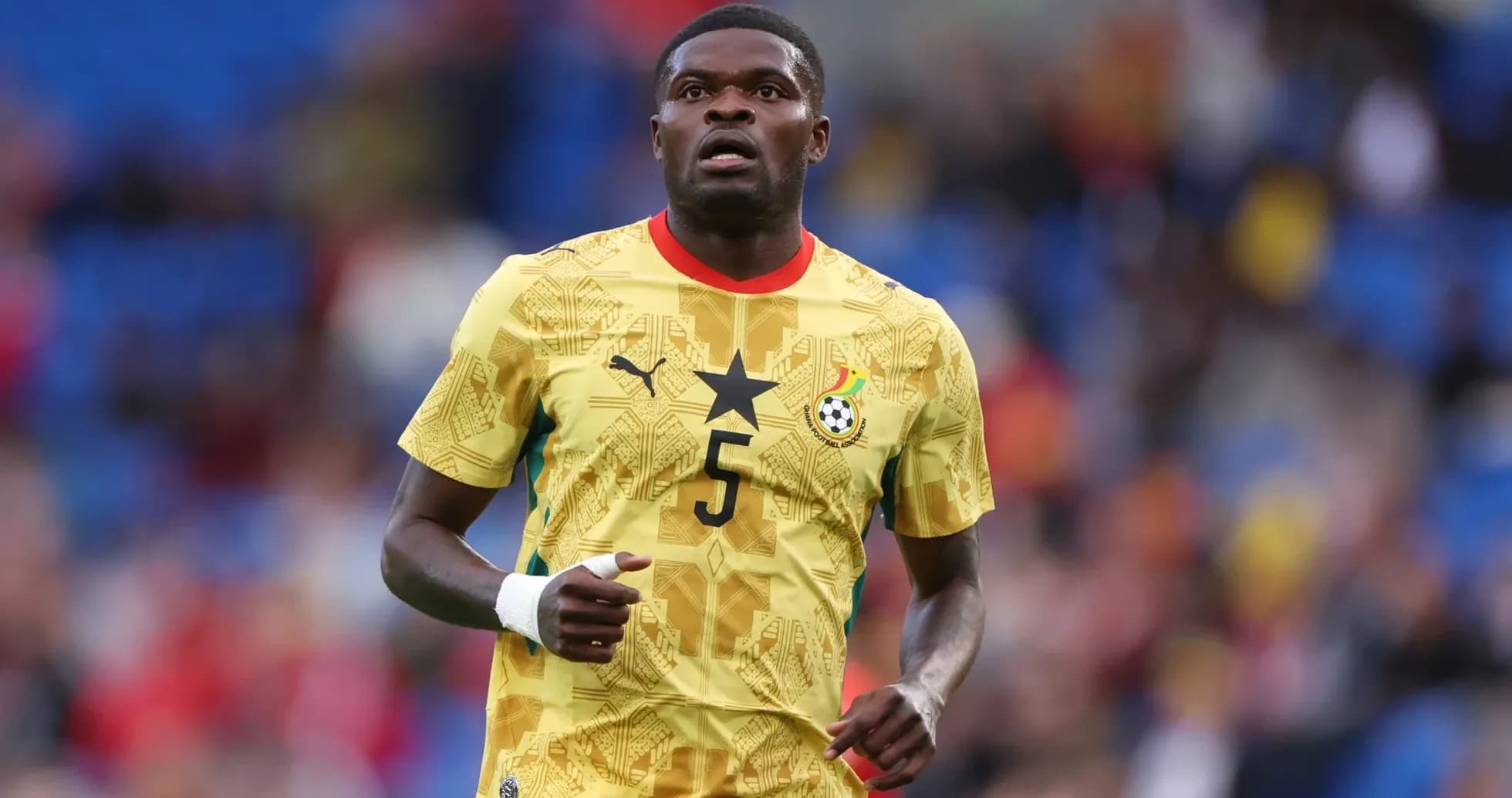 Player wearing Ghana national team jersey on field