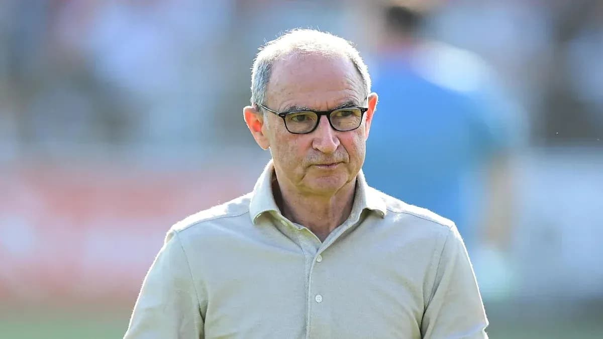 Coach walking on the field during match