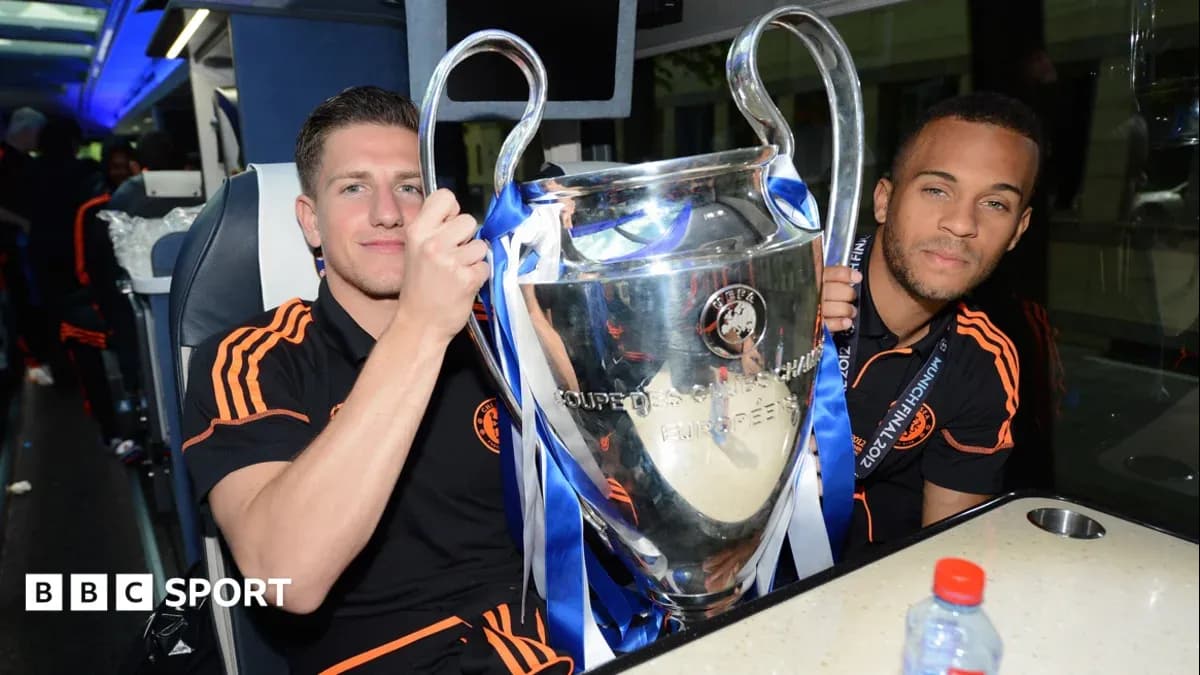 Players celebrating with UEFA Champions League trophy