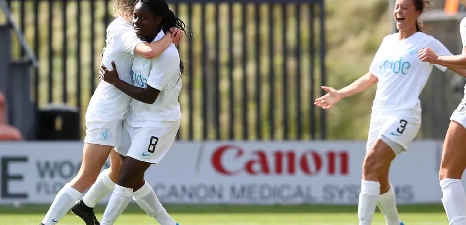 Players celebrating a goal during match