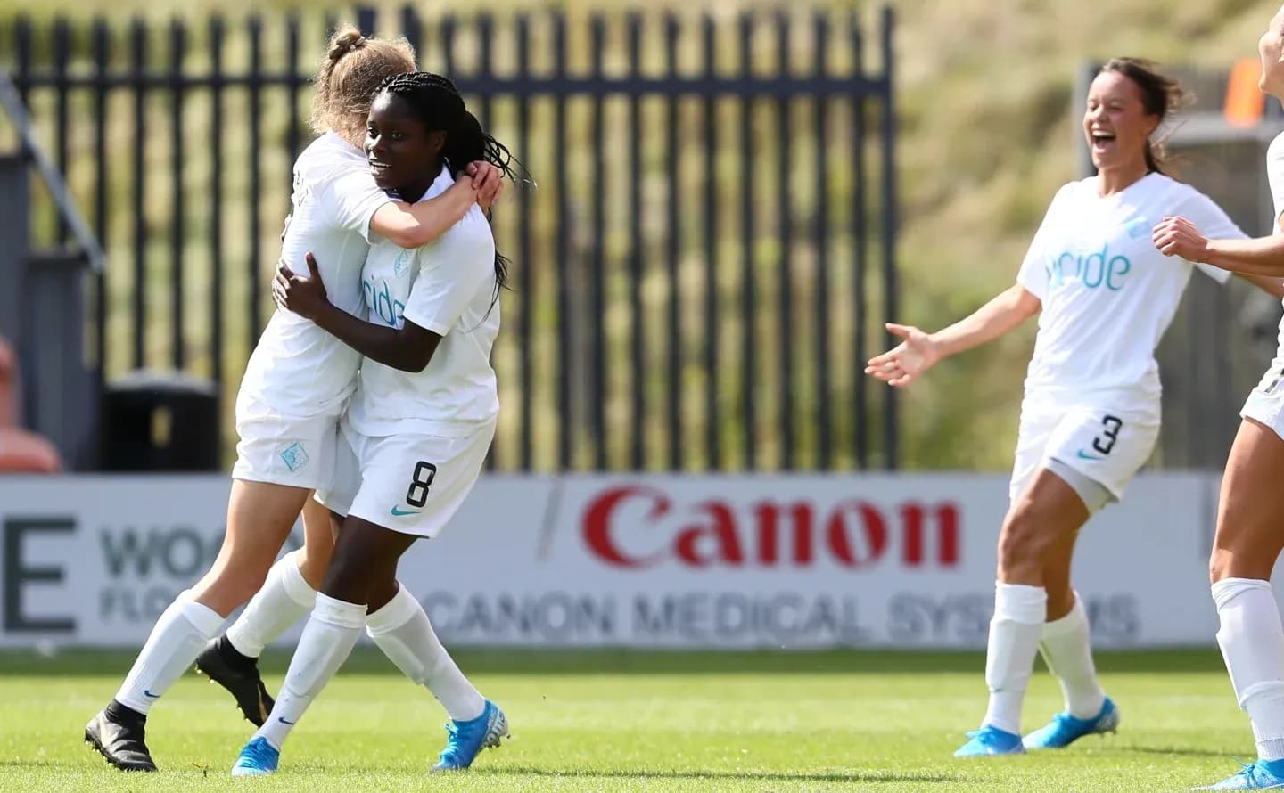 Players celebrating a goal during match