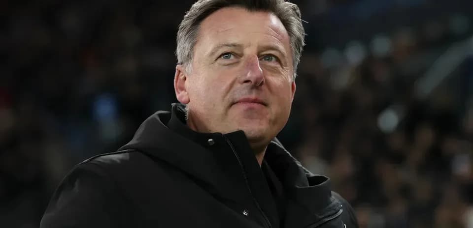 Coach observing match from the sidelines