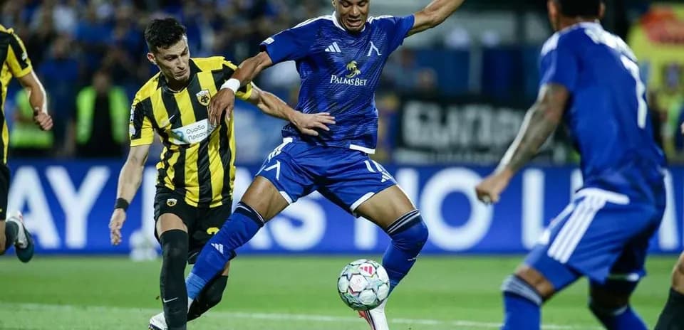 Levski Sofia player dribbling against AEK Athens