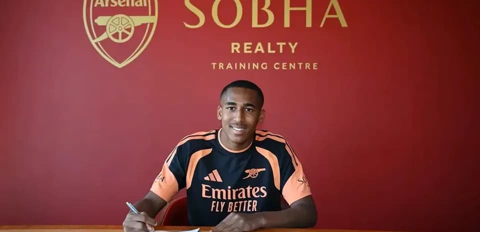 Player signing contract at Arsenal training center