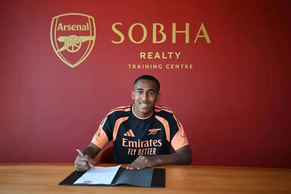Player signing contract at Arsenal training center