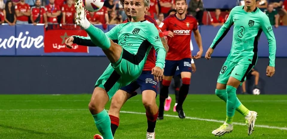 Atletico Madrid player executing a kick