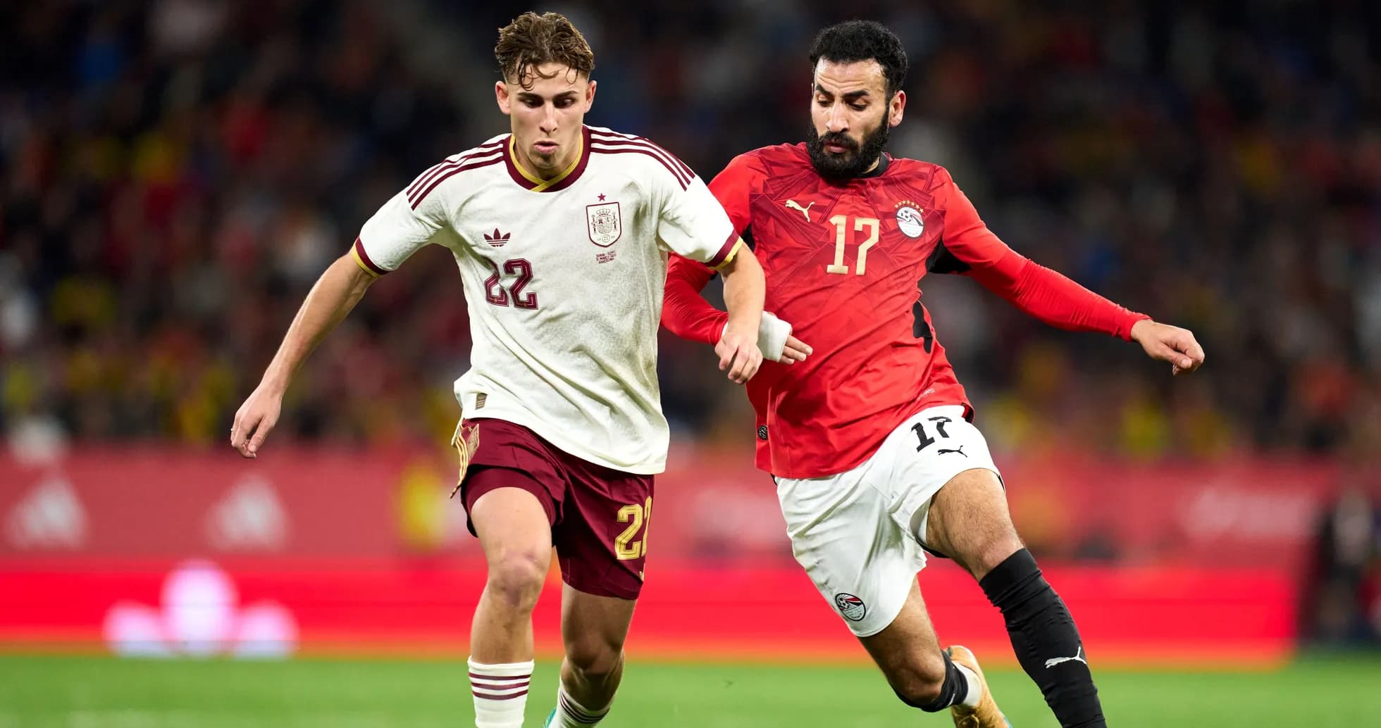 Two players contesting the ball during a match