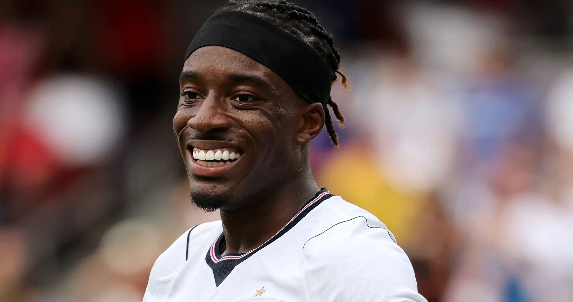 Player smiling during a football match