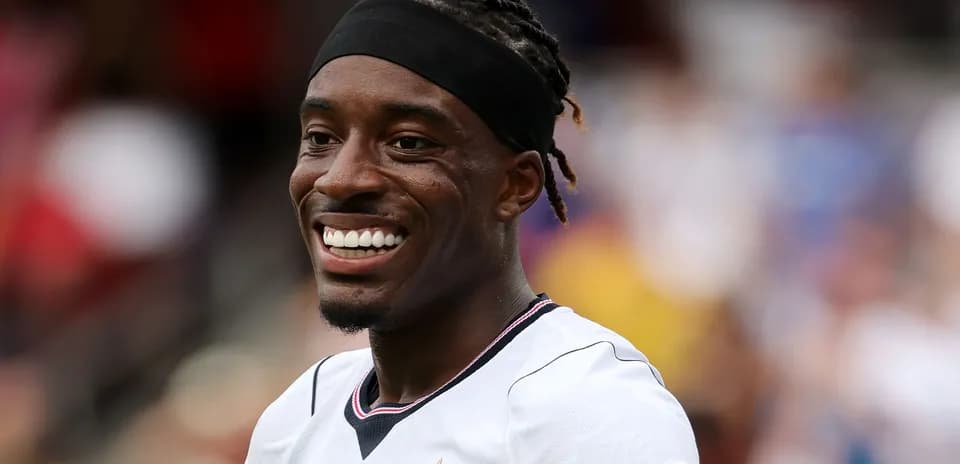 Player smiling during a football match