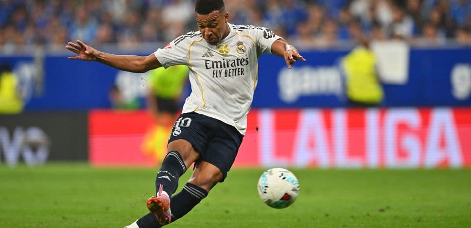 Player from Real Madrid kicking the ball