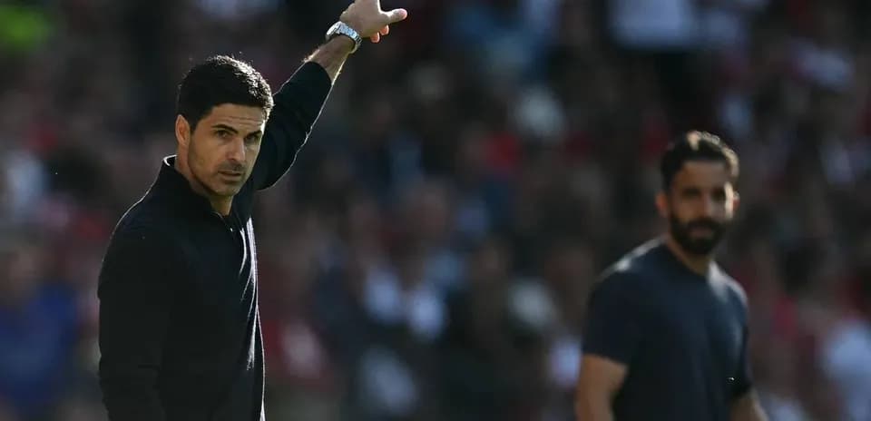 Coach gesturing on the sidelines during match