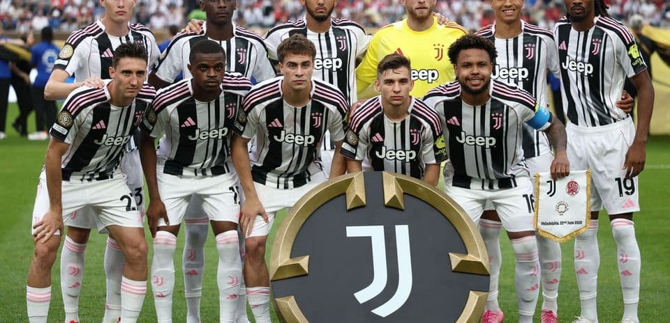 Juventus team posing with club banner before match