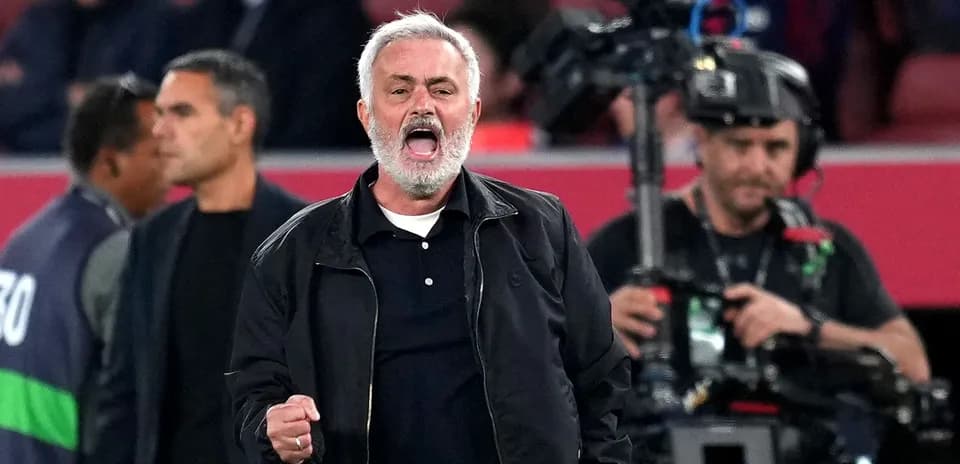 Manager celebrating passionately during a match