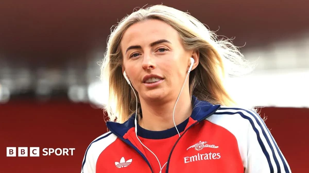 Player walking onto the pitch wearing headphones