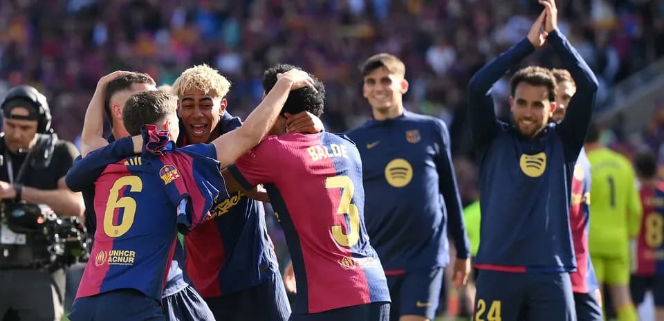 Barcelona players celebrating a goal on the pitch