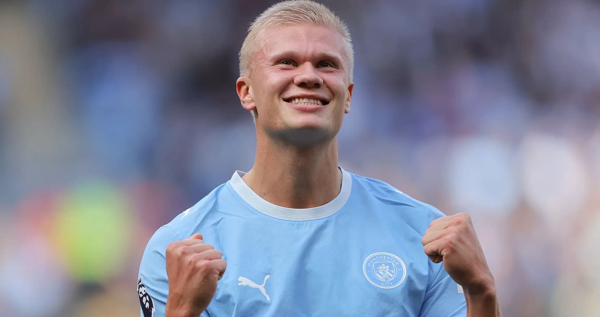 Player celebrating in Manchester City jersey