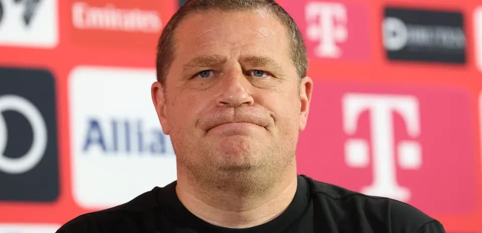 Manager at press conference with sponsor backdrop