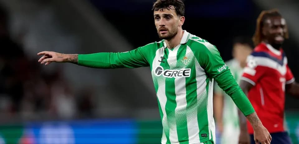 Player in green jersey gesturing during match
