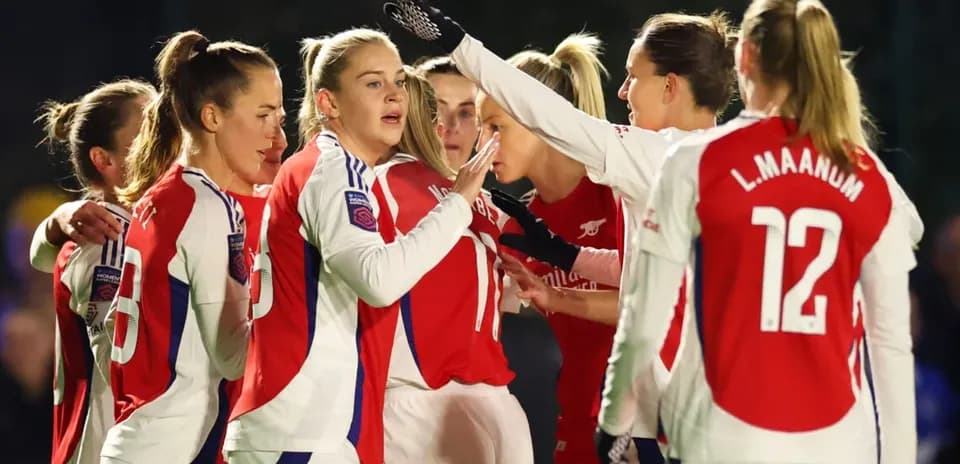 Arsenal W celebrating a goal during match