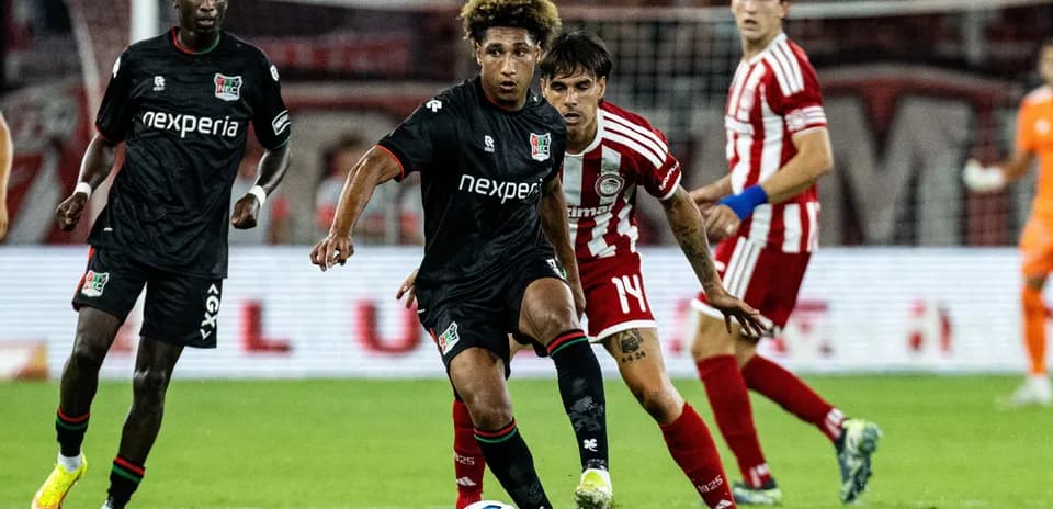 NEC Nijmegen player dribbling against Olympiakos