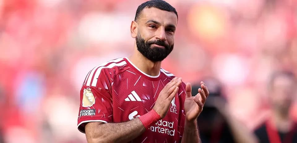 Player applauding fans at stadium after match