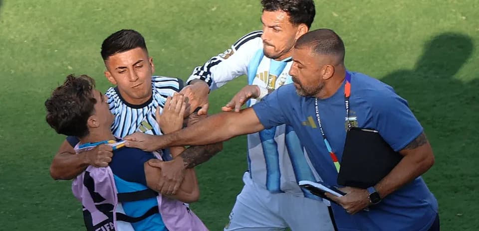 Players and coach involved in a confrontation on field