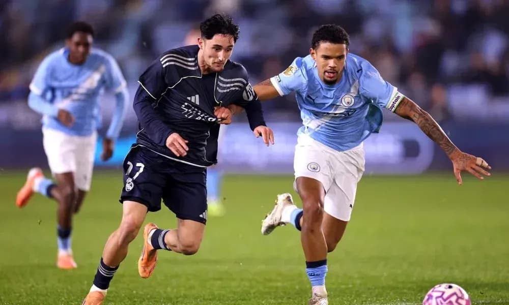 Players from Real Madrid and Manchester City competing for possession