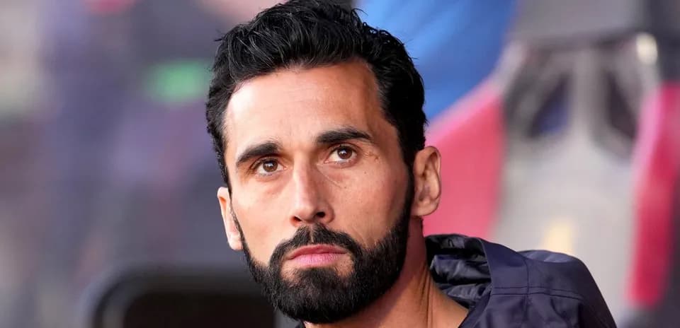 Man with beard sitting on sports bench