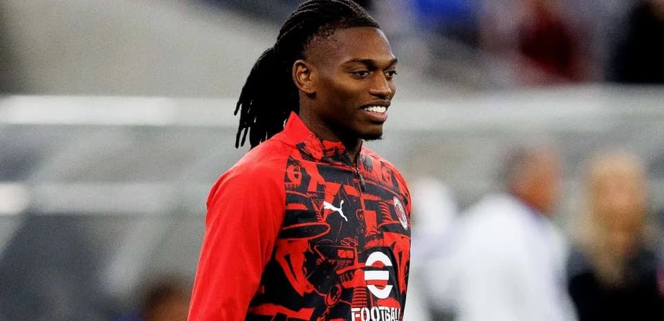 Player wearing red training kit before match