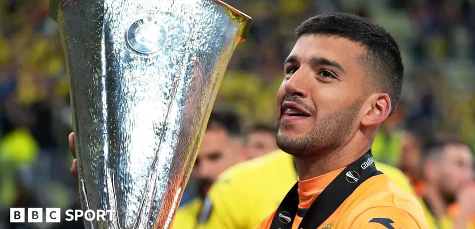 Player celebrating with UEFA Europa League trophy