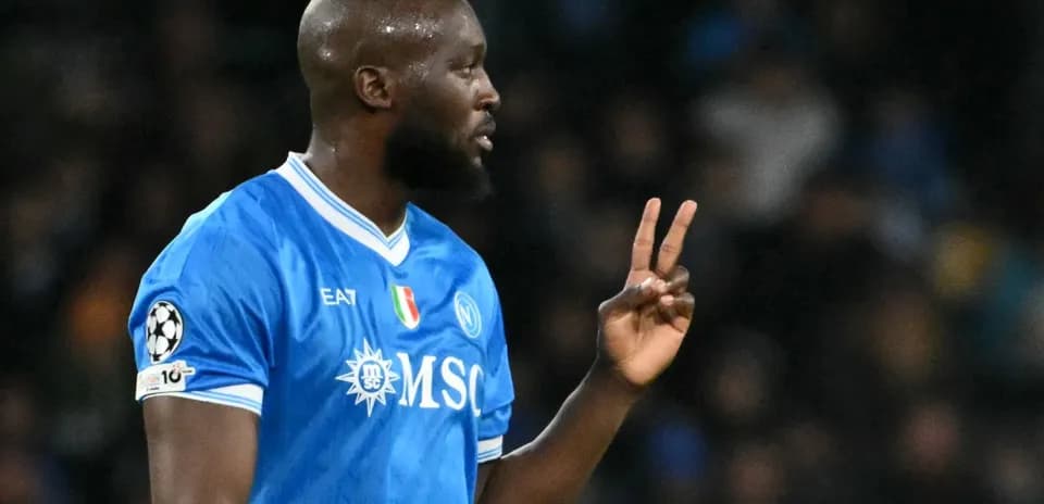 Player in blue jersey signaling during match