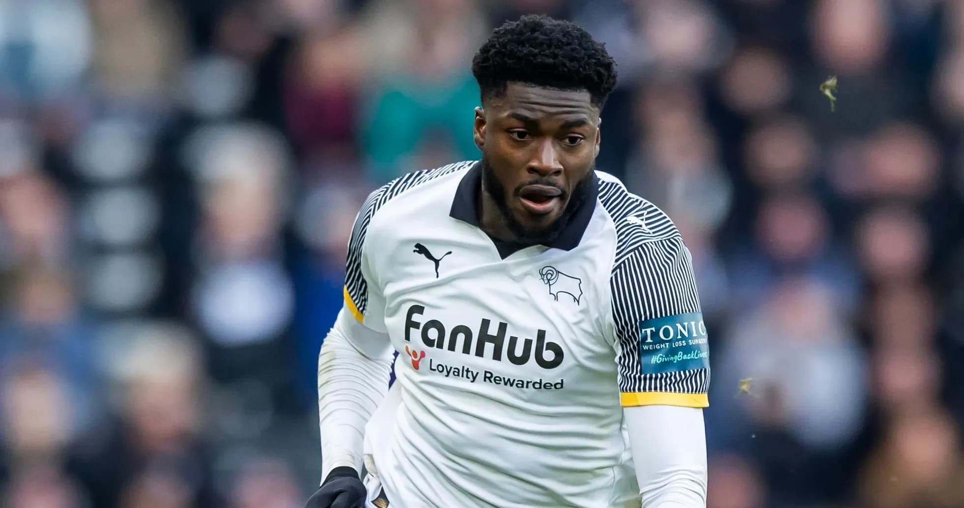 Player in action wearing Derby County kit